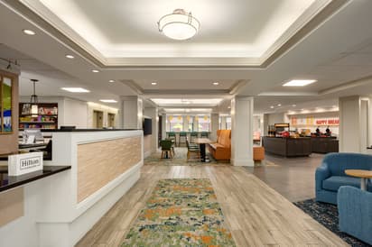 Photo of lobby area of the hotel including guest check-in desk 