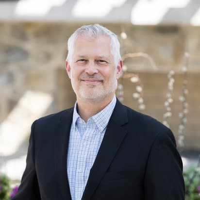 Andy Sims photo in the courtyard of Leadership Center